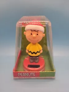 Charlie Brown in Yellow Christmas Solar Bobbler New in Taped Original Packaging - Picture 1 of 6