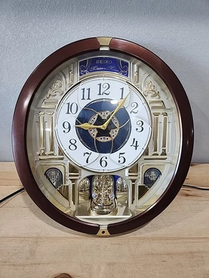 Reloj Seiko 18 Melodías en Movimiento Péndulo Giratorio Hey Jude Deck The Halls Etc. Foto 1 de 4
