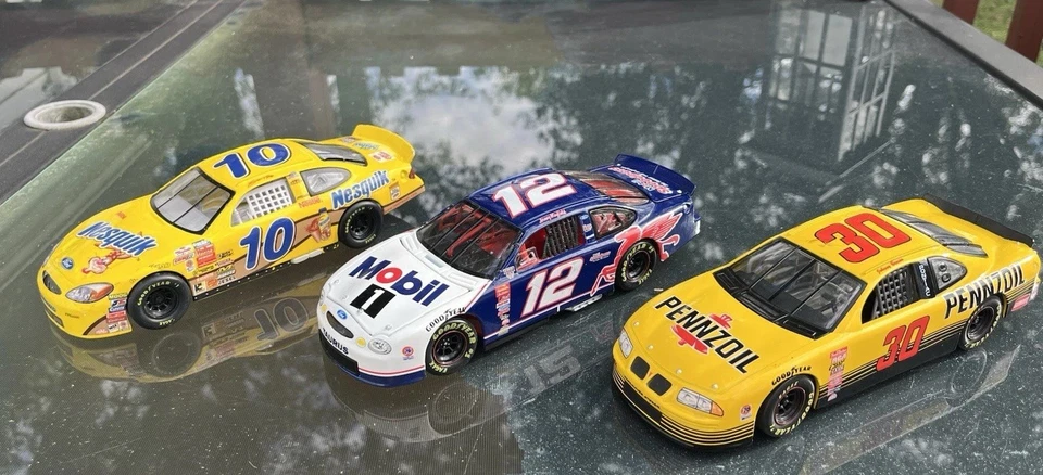 Lot Of (3) NASCAR 1:24 Diecasts Jonny Benson #30 Jeremy Mayfield #12 Scott Riggs - Image 1 of 4
