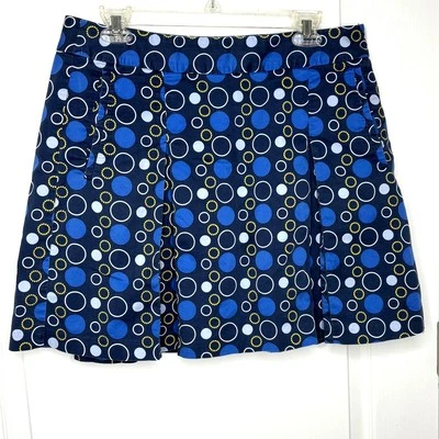 Falda corta de golf LizGolf Wms talla 12 azul con estampado circular plisada bolsillos cremallera lateral Foto 1 de 4