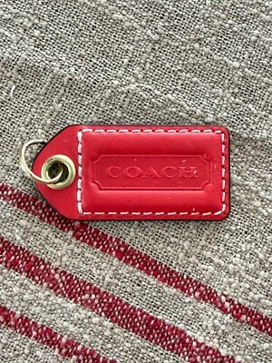 Etiqueta colgante de repuesto Coach cuero tono naranja/rojo dorado Foto 1 de 4