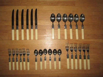 Vtg MIKASA Stainless Flatware Off-White Plastic Handles 6 @ 5 Pc Place Settings - Image 1 of 4