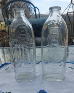 Vintage 8 Oz Glass Baby Bottles Embossed elephants and dogs - Picture 1 of 11