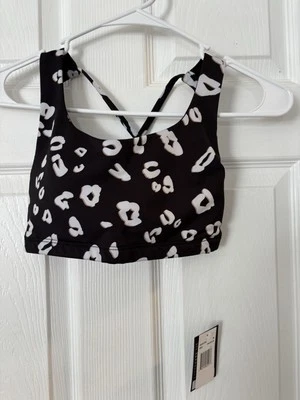 Sujetador deportivo Onzie para mujer negro mudra estampado de leopardo con tiras talla S/M $52 Foto 1 de 4