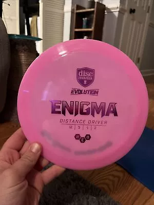 Discmania Evolution Neo Enigma 173g Pink Purple Foil Driver Golf Disc - Image 1 of 3