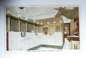 1942 POSTKARTE GARDNER Illinois Lobby Exchange BANK m. Elchkopf - Bild 1 von 2