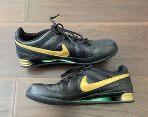 Scarpe da ginnastica atletiche Nike Shox Rivalry nere/oro in pelle da donna taglia 6,5 - Foto 1 di 12