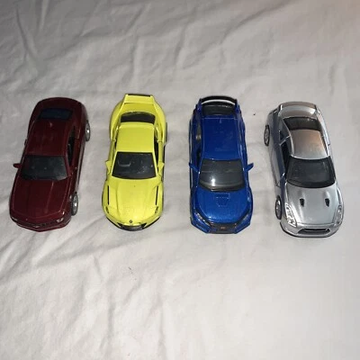 4 coches fundidos a presión Maisto Camaro BMW Honda Nissan Foto 1 de 4