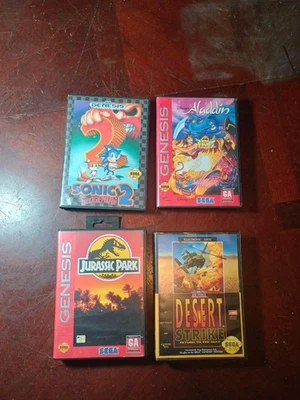 Lote de 4 juegos de Sega Genesis Aladdin, Sonic, Jurassic Park y Desert Strike Foto 1 de 4