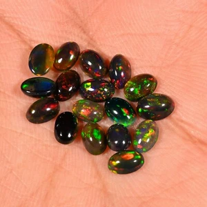 Cabujón de ópalo de fuego welo etíope negro piedra preciosa suelta A++ ópalo de fuego Welo 4x6MM - Imagen 1 de 8