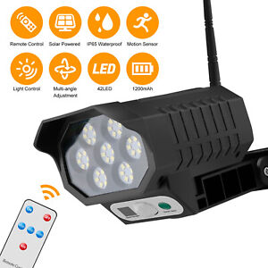 LED Solar Wall Light Motion Sensor Outdoor Security Fake Camera Remote Lamp