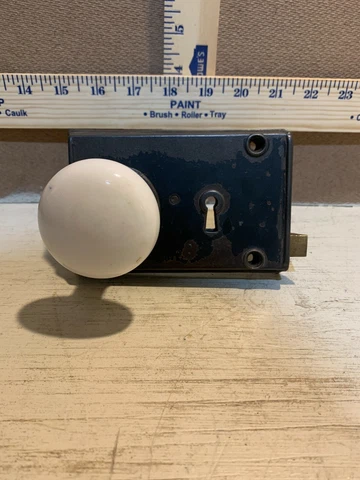 Antique Cast Iron Door Lock With White Porcelain Knobs Cover