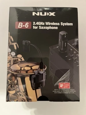 Sistema inalámbrico saxofón NUX B-6 con estuche de carga. Foto 1 de 2