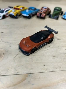 Hot Wheels Exotic Envy - Aston Martin Vulcan (Orange) - Picture 1 of 5