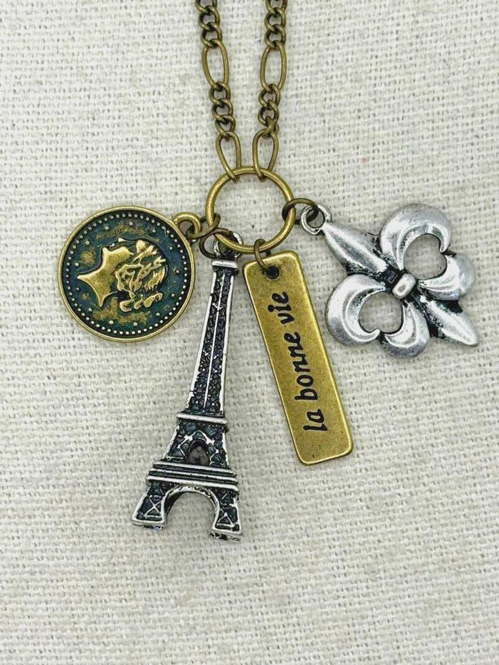 Claires Fleur De Lis Eiffel Tower La Bonne Vie Bar French Coin Charm Necklace - Image 1 of 1
