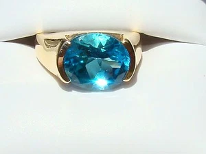 ANILLO TOPACIO AZUL FORMA OVALADA - 14K - 6 CTS - TALLA 6 - Imagen 1 de 3