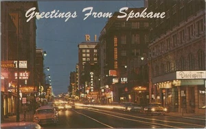 Greetings from Spokane Washington night neon autos stores postcard F21 - Picture 1 of 2