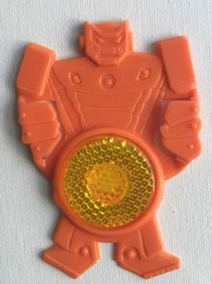 De Colección 1985 Kellogg Cereal Premium Bicicleta Reflector Naranja Robot Transformador Foto 1 de 2