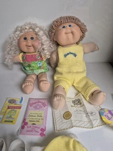 2 Cabbage Patch Dolls With Clothes And Birth Certificates And Some Accessories - Picture 1 of 10