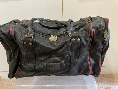 vintage puma holdall, black with gold lettering, approx 20"x 10"x 10" - Image 1 of 4