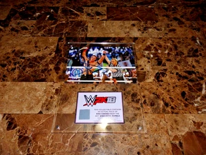 FOTO AUTÓGRAFA RARA DE JOHN CENA WWE 2K18 Y PIEZA DE ALFOMBRILLA ROYAL RUMBLE 2017 - Imagen 1 de 8