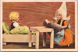 1953 Netherlands Postcard Dutch Girl Reading to Boy in Bed / ROTTERDAM Cancel - Picture 1 of 2