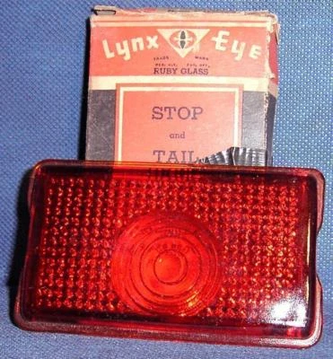 RF1132 1942 - 47 Oldsmobile Lynx Eye Stop Brake Tail Light Lens NORS - Image 1 of 2