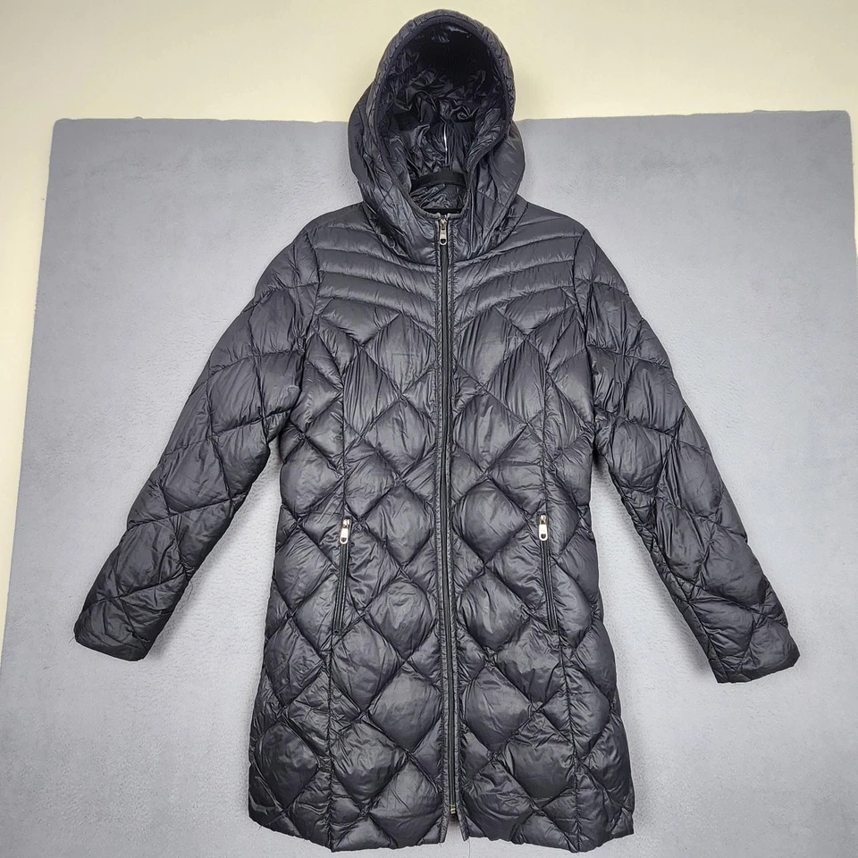 Chaqueta acolchada larga con capucha negra grande Steve Madden Puffer para mujer Foto 1 de 4