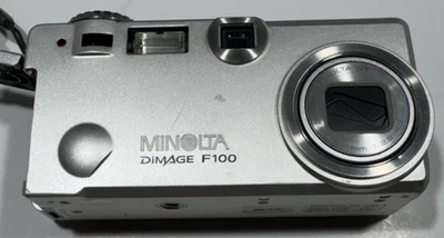 Minolta DiMAGE F100 4MP Compact Digital Camera–Silver - Battery Door Won't Lock - Image 1 of 4