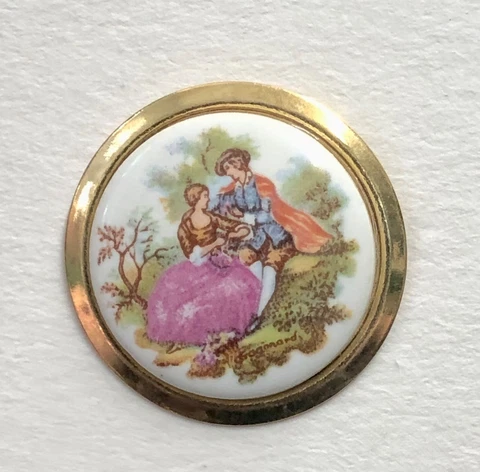Colonial Couple Porcelain Set in Metal Large Button - Sitting on Grass Cover