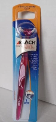 Palo de hilo dental diario Reach Access rosa transparente Johnson & Johnson 1 cabezal de hilo dental Foto 1 de 4