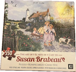 Karmin 550 Piece Jigsaw Puzzle "Rose Cottage Lane" by Susan Brabeau - Picture 1 of 1