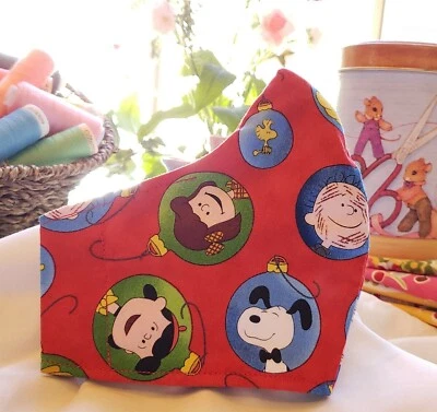 Mascarilla navideña Peanuts Charlie Brown Snoopy adulto/niños algodón racbrez Foto 1 de 4