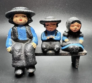 Vintage Miniature Cast Iron Sitting Amish Man Boy & Girl w/ Bench Black Blue - Picture 1 of 16