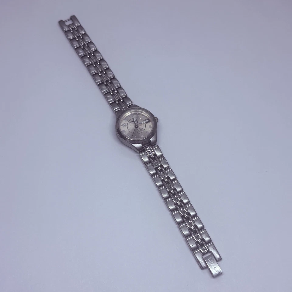 Reloj para mujer Sharp SHP5304 vintage 23 mm tono plata fecha 7,25” esfera rosa 31 Foto 1 de 4
