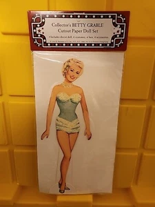 Juego de 6 disfraces de muñeca de papel recortado Betty Grable de coleccionista 4 sombreros 6 accesorios - Imagen 1 de 2