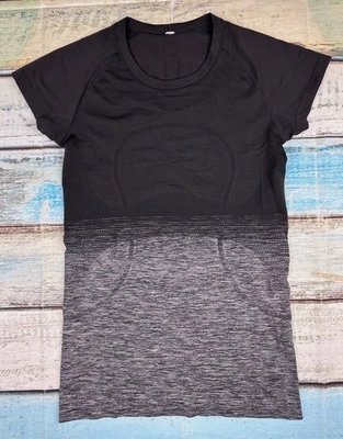 Lululemon Woman's Size 6 Swiftly Tech Short Sleeve Crew Heathered Black & Gray - Image 1 of 4