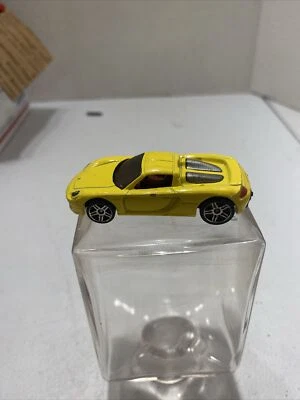 Hot Wheels Porsche Carrera GT 2009 amarillo Dream Garage suelto C1 Foto 1 de 4
