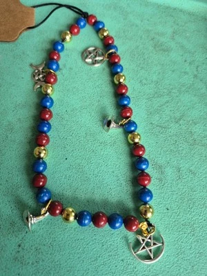 Dije de teléfono celular pagano Foto 1 de 4