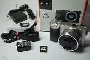 Sony Alpha a 6000 + Objektiv SELP1650 Silber circa 8070 Klicks in OVP - Bild 1 von 3