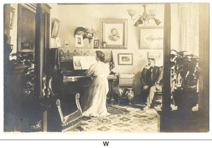 VICTORIAN PARLOR ca1908 RPPC - Furniture, Piano, Pictures, People - Picture 1 of 2