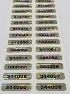 100 SMALL NUMBERED BRIGHT SILVER TAMPER EVIDENT HOLOGRAM LABELS .75 X .25 INCH - Picture 1 of 2