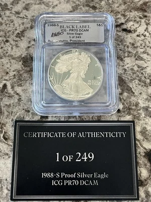 1988–S Black label ICG - PR70 DCAM Silver Eagle 1-249 Signed By Austin Hutto - Image 1 of 2