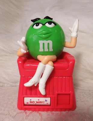 M&M GREEN WITH WHITE BOOTS RED CHAIR FEMALE FORTUNE TELLER CANDY DISPENSER - Image 1 of 4