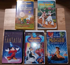Case Lot  5 VHS Clam Shell Disney Classic Movies Charlie Brown,Alladdin,Mary... - Picture 1 of 3