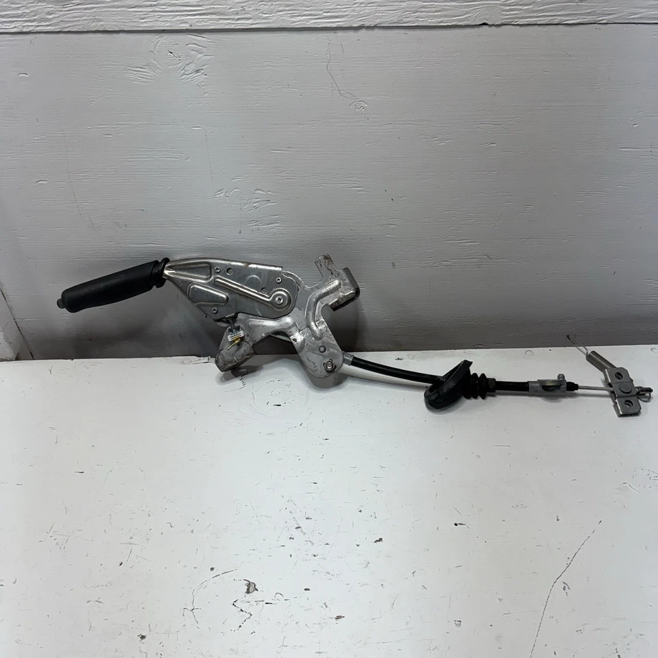 Nissan NV200 2013-2021 Chevrolet City manija de control de freno de estacionamiento con cable OEM Foto 1 de 4