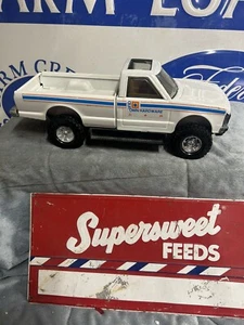 VINTAGE ERTL OUR TOWN HARDWARE STORE LIFTED PICKUP TRUCK - Picture 1 of 4