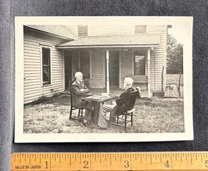 Photograph~Two Old Men Sitting Outside Smoking Cigars & Playing Checkers - Picture 1 of 3