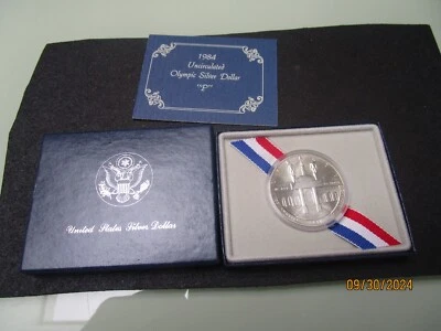 1984 P $1 Olympic Silver Dollar Uncirculated Coliseum Coin Box and COA - Image 1 of 3