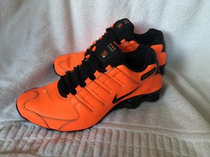 orange and black nike shox